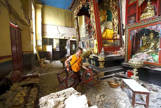 A monk carrying chairs walks out from the damaged monastery at Swoyambhunath Stupa, a UNESCO world heritage site in Kathmandu, Nepal on April 28, 2015. Reuters/Navesh Chitrakar A monk carrying chairs walks out from the damaged monastery at Swoyambhunath Stupa, a UNESCO world heritage site in Kathmandu, Nepal on April 28, 2015. Reuters/Navesh Chitrakar
