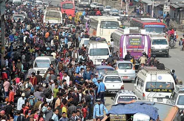 Nepalese people wait to board buses to leave Kathmandu on the outskirts of Kalanki fearing fresh tremors on April 28, 2015. AFP Photo/Prakash Singh Nepalese people wait to board buses to leave Kathmandu on the outskirts of Kalanki fearing fresh tremors on April 28, 2015. AFP Photo/Prakash Singh