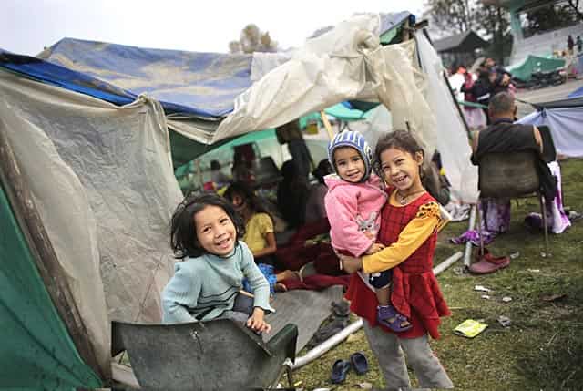 Survivors play outside their tent at a makeshift camp in Kathmandu, Nepal on April 28, 2015. (AP Photo/Altaf Qadri) Survivors play outside their tent at a makeshift camp in Kathmandu, Nepal on April 28, 2015. (AP Photo/Altaf Qadri)