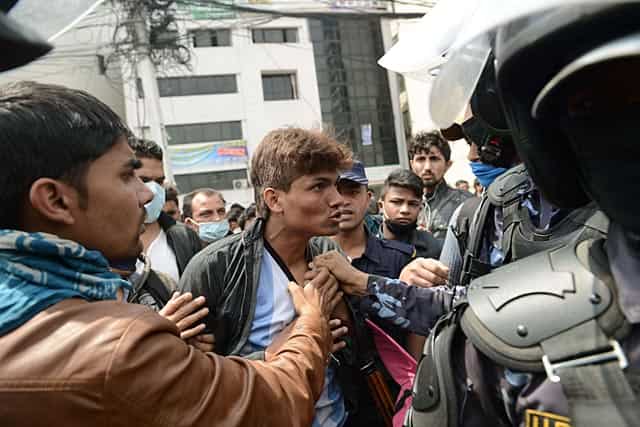 Nepalese police push back residents who began protesting after waiting for hours in line to board buses back to other towns and villages from Kathmandu on April 29, 2015. AFP Photo/Prakash Mathema Nepalese police push back residents who began protesting after waiting for hours in line to board buses back to other towns and villages from Kathmandu on April 29, 2015. AFP Photo/Prakash Mathema