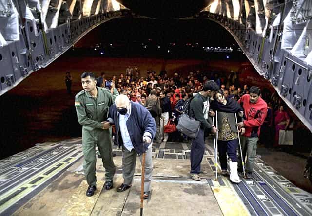 Indian Air Force personnel help survivors to board a military plane, evacuating injured and stranded Indians from Kathmandu to New Delhi. AP/PTI Indian Air Force personnel help survivors to board a military plane, evacuating injured and stranded Indians from Kathmandu to New Delhi. AP/PTI
