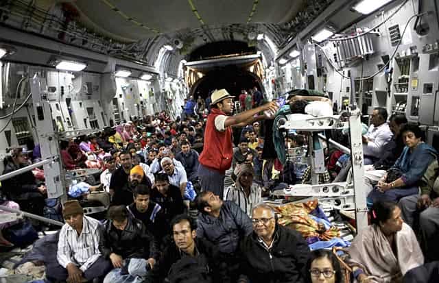 An attendant pours water into the mouth of an injured evacuee as he lies on a stretcher inside a military plane evacuating injured and stranded Indians from Kathmandu to New Delhi on April 29, 2015. AP/PTI An attendant pours water into the mouth of an injured evacuee as he lies on a stretcher inside a military plane evacuating injured and stranded Indians from Kathmandu to New Delhi on April 29, 2015. AP/PTI