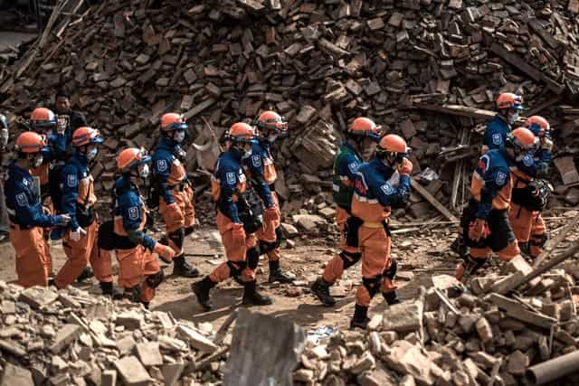 Rescuers from Japan are seen in the historical centre of Kathmandu on April 29, 2015. AFP Photo/Philippe LOPEZ Rescuers from Japan are seen in the historical centre of Kathmandu on April 29, 2015. AFP Photo/Philippe LOPEZ