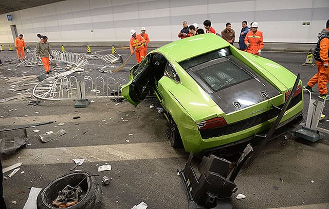 This photo taken early on April 12, 2015 shows a badly damaged Lamborghini car and debris in a tunnel after a crash involving a Ferrari in Beijing. AFP Photo This photo taken early on April 12, 2015 shows a badly damaged Lamborghini car and debris in a tunnel after a crash involving a Ferrari in Beijing. AFP Photo