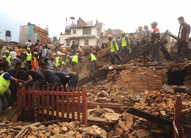 Rescuers clear the debris at Durbar Sqaure in Kathmandu, Nepal, on April 25, 2015. (AP Photo/ Niranjan Shrestha) Rescuers clear the debris at Durbar Sqaure in Kathmandu, Nepal, on April 25, 2015. (AP Photo/ Niranjan Shrestha)