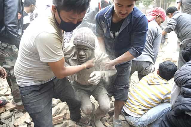 People free a man from the rubble of a destroyed building in Kathmandu. (EPA/Narendra Shrestha) People free a man from the rubble of a destroyed building in Kathmandu. (EPA/Narendra Shrestha)