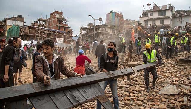 Emergency rescue workers clear debris in Basantapur Durbar Square while searching for survivors on April 25, 2015 in Kathmandu, Nepal. (Photo by Omar Havana/Getty Images) Emergency rescue workers clear debris in Basantapur Durbar Square while searching for survivors on April 25, 2015 in Kathmandu, Nepal. (Photo by Omar Havana/Getty Images)