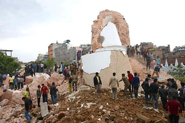 Nepalese rescue members and onlookers gather at the collapsed Darahara Tower in Kathmandu. (AFP Photo/Prakash Mathema) Nepalese rescue members and onlookers gather at the collapsed Darahara Tower in Kathmandu. (AFP Photo/Prakash Mathema)