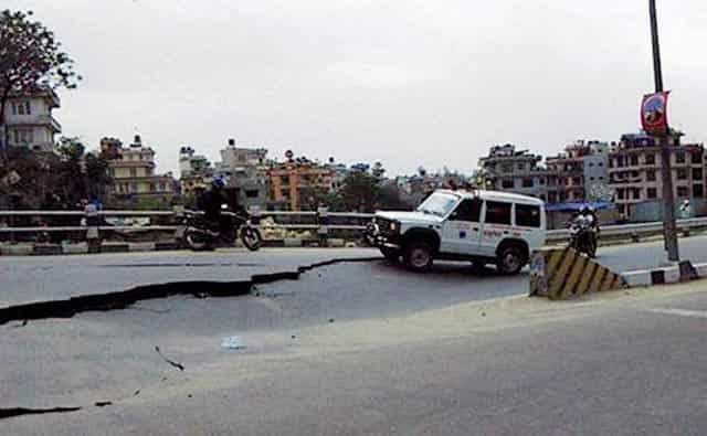 A damaged road in Kathmandu. PTI Photo A damaged road in Kathmandu. PTI Photo