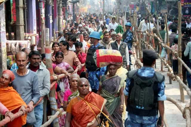 Devotees stand in a queue to offer prayers to Lord Shiva at Kashi Vishwanath Temple on the occasion of 'Mahashivratri' in Varanasi. PTI Photo Devotees stand in a queue to offer prayers to Lord Shiva at Kashi Vishwanath Temple on the occasion of 'Mahashivratri' in Varanasi. PTI Photo