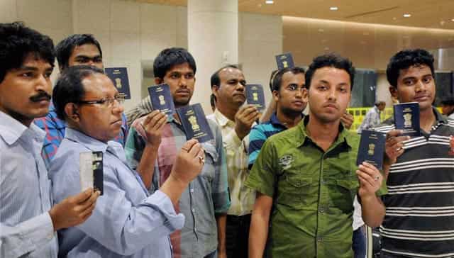 Indian nationals from Kolkata who were stranded in Yemen show their passports, upon arrival at International Airport in Mumbai. PTI Photo Indian nationals from Kolkata who were stranded in Yemen show their passports, upon arrival at International Airport in Mumbai. PTI Photo