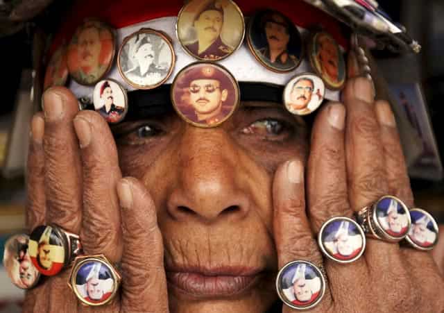 A woman supporting Yemen's former President Ali Abdullah Saleh, wears a pin with an image of Saleh's son Ahmed Ali Abdullah Saleh (C), during a rally against airstrikes, in Sanaa. Reuters Phot) A woman supporting Yemen's former President Ali Abdullah Saleh, wears a pin with an image of Saleh's son Ahmed Ali Abdullah Saleh (C), during a rally against airstrikes, in Sanaa. Reuters Phot)