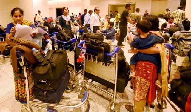 Indian nationals evacuated from Yemen, upon their arrival at the International Airport in Mumbai. PTI Photo Indian nationals evacuated from Yemen, upon their arrival at the International Airport in Mumbai. PTI Photo