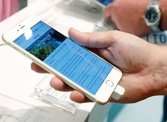 File photo of a person looking at the screen on the new iPhone 6 Plus. AP Photo File photo of a person looking at the screen on the new iPhone 6 Plus. AP Photo