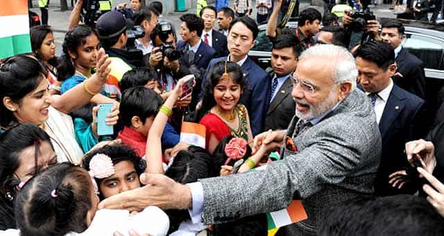 Prime Minister Narendra Modi, right, is greeted by Indian residents in South Korea as he visits the Cheonggye stream in Seoul, South Korea.AP Photo Prime Minister Narendra Modi, right, is greeted by Indian residents in South Korea as he visits the Cheonggye stream in Seoul, South Korea.AP Photo