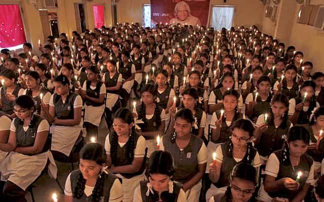 School girls hold candles as they sit in front of a portrait of former president Kalam during a prayer ceremony in Chennai on July 28, 2015. Reuters Photo School girls hold candles as they sit in front of a portrait of former president Kalam during a prayer ceremony in Chennai on July 28, 2015. Reuters Photo