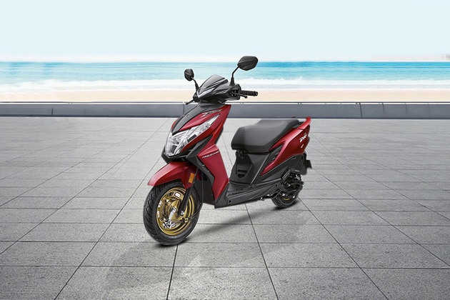 Honda Dio Vs Bajaj Dominar 400 Comparison Prices Mileage Specs Features