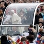 Pope Francis made a big change to the Popemobile when he decided to get rid of bulletproof screens. This enables him to add a more personal touch to his interactions as can be seen here. (AP Photo)