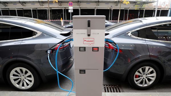 Tesla Model X electric cars recharge their batteries in Berlin. (Reuters)