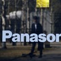 FILE PHOTO: A man is reflected on Panasonic Corp's logo at Panasonic Center in Tokyo (Reuters)