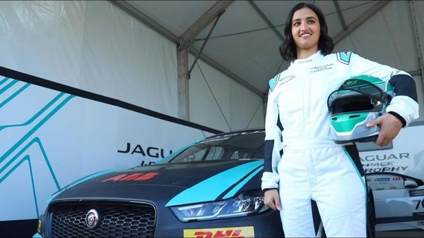 Reema Juffali - first Saudi woman driver to race standing next to her Jaguar I-Pace (AFP)