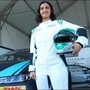 Reema Juffali - first Saudi woman driver to race standing next to her Jaguar I-Pace (AFP)