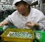 An employee works at a production line of lithium ion batteries inside a factory in China. (Reuters)