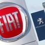 FILE PHOTO: The logos of car manufacturers Fiat and Peugeot