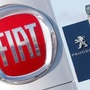 FILE PHOTO: The logos of car manufacturers Fiat and Peugeot