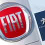 FILE PHOTO: The logos of car manufacturers Fiat and Peugeot