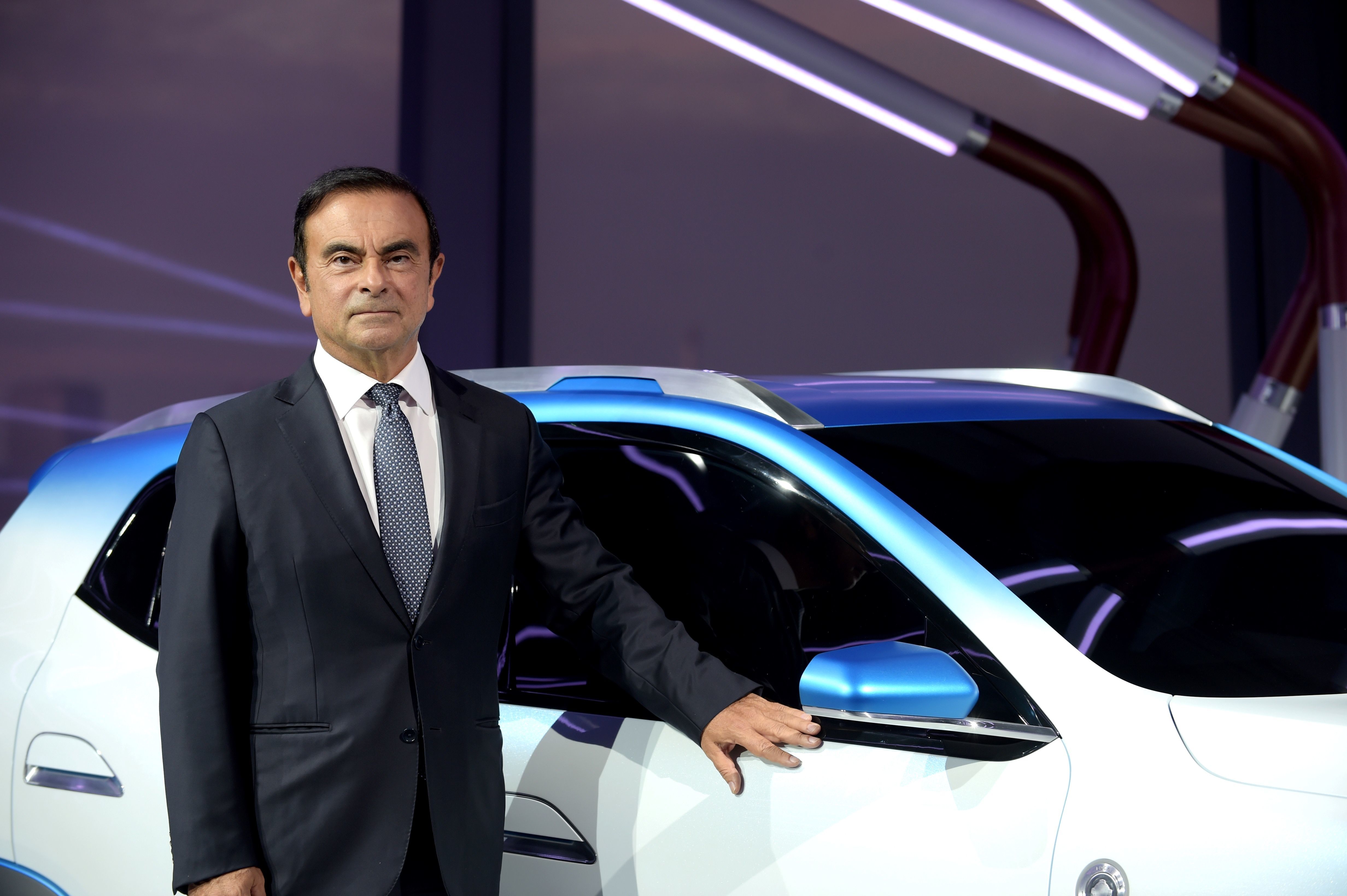 (FILES) In this file photo taken on October 01, 2018 then Chairman and CEO of Renault-Nissan-Mitsubishi Carlos Ghosn presents the Renault K-ZE for the Chinese market during a world premiere as part of an Renault 'electric evening' on the eve of the first press day of the Paris Motor Show. - Former Nissan chief Carlos Ghosn, who was on bail in Tokyo awaiting trial on financial misconduct charges, has arrived in Beirut, Lebanese official and security sources said on December 30, 2019. (Photo by ERIC PIERMONT / AFP)