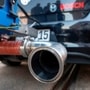 (FILES) This file photo taken on April 17, 2018 shows the exhaust pipe of a diesel powered Volkswagen Golf testcar of German electronic and engineering company Bosch with a portable emission measurement system is displayed in Stuttgart, southern Germany. - German prosecutors searched car giant Volkswagen's offices on December 3, 2019 over the long-running 'dieselgate' emissions cheating scandal, the company said, adding it was cooperating with authorities. (Photo by THOMAS KIENZLE / AFP) (AFP)