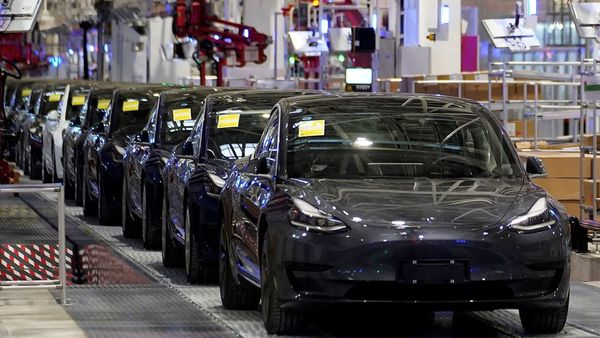 Tesla China-made Model 3 vehicles are seen during a delivery event at its factory in Shanghai, China. (REUTERS)