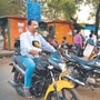 Motorcycles can be hailed at stands, popular markets and key junctions; and (right) old-timers have regular pilots whom they call home or set pre-decided pick-up times with.