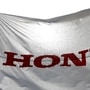FILE PHOTO: A flag with the company logo flies outside the Honda Motor Co. plant in Yorii, Saitama prefecture, Japan, March 8, 2016. REUTERS/Thomas Peter/File Photo