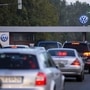 FILE PHOTO: Cars drive through the 'Sandkamp Gate' to the Volkswagen factory in Wolfsburg, Germany, September 23, 2015. REUTERS/Axel Schmidt/File Photo