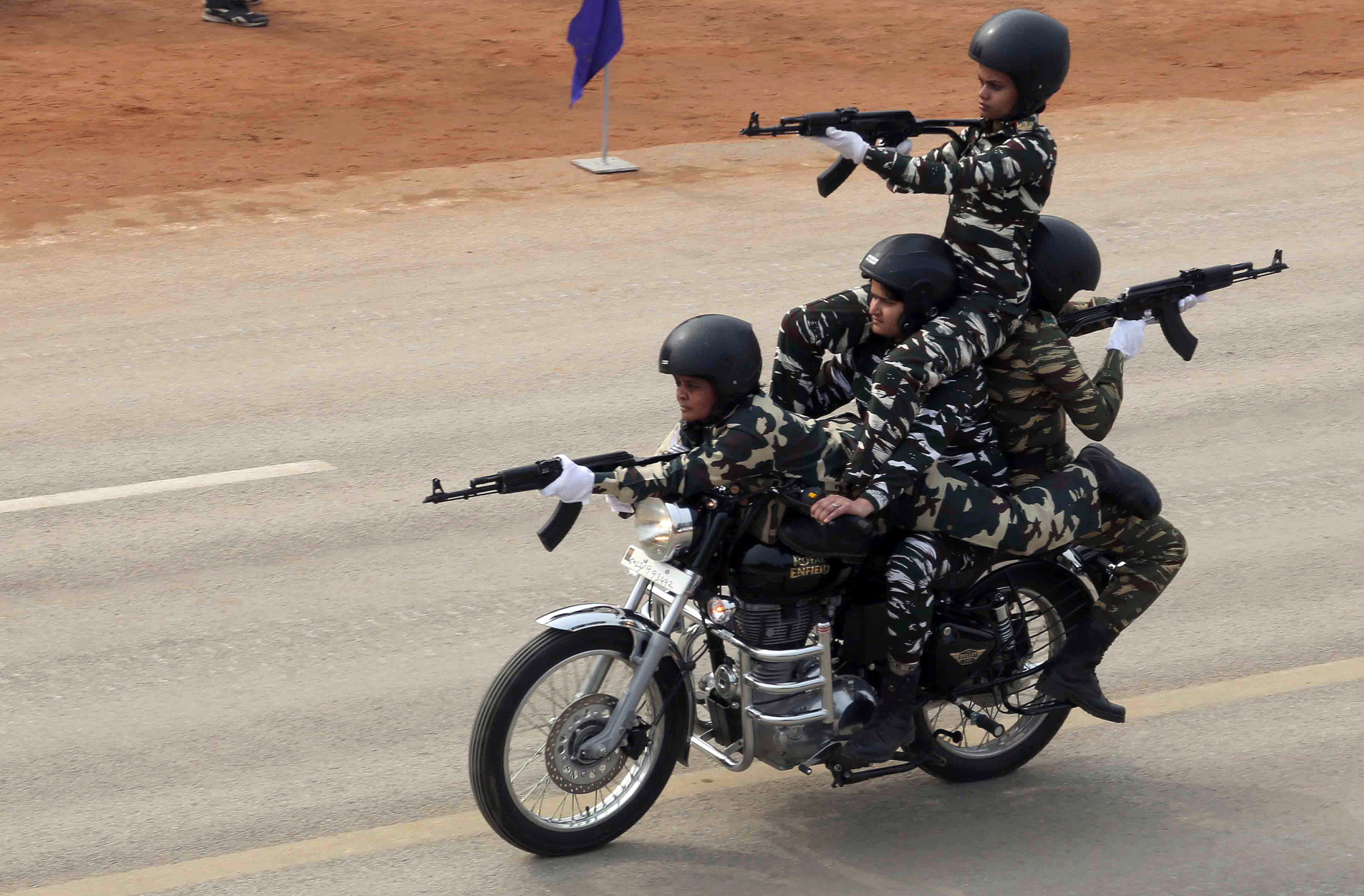 CRPF women soldiers perform a stunt during a rehearsal for the upcoming Republic Day Parade, at Rajpath in New Delhi on Monday. (ANI Photo)