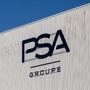 A logo sits on the exterior of the PSA Group automobile factory in Poissy, France, on Monday, Jan. 6, 2020. The board of French carmaker PSA Group unanimously approved a merger with Fiat Chrysler Automobiles NV that will create the world's fourth-biggest auto manufacturer, according to people familiar with the situation. Photographer: Anita Pouchard Serra/Bloomberg (Bloomberg)