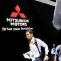 FILE PHOTO: A man walks near Mitsubishi cars as he visits Tokyo Motor Show in Tokyo. (REUTERS)