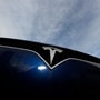 FILE - In this Nov. 10, 2019, file photo the company logo shines off the grille of an unsold 2020 Model X at a Tesla dealership in Littleton, Colo. Tesla reports financial results on Wednesday, Jan. 29, 2020. (AP Photo/David Zalubowski, File) (AP)