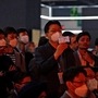 Visitors use their mobile phones to film vehicles at the India Auto Expo 2020. (REUTERS)