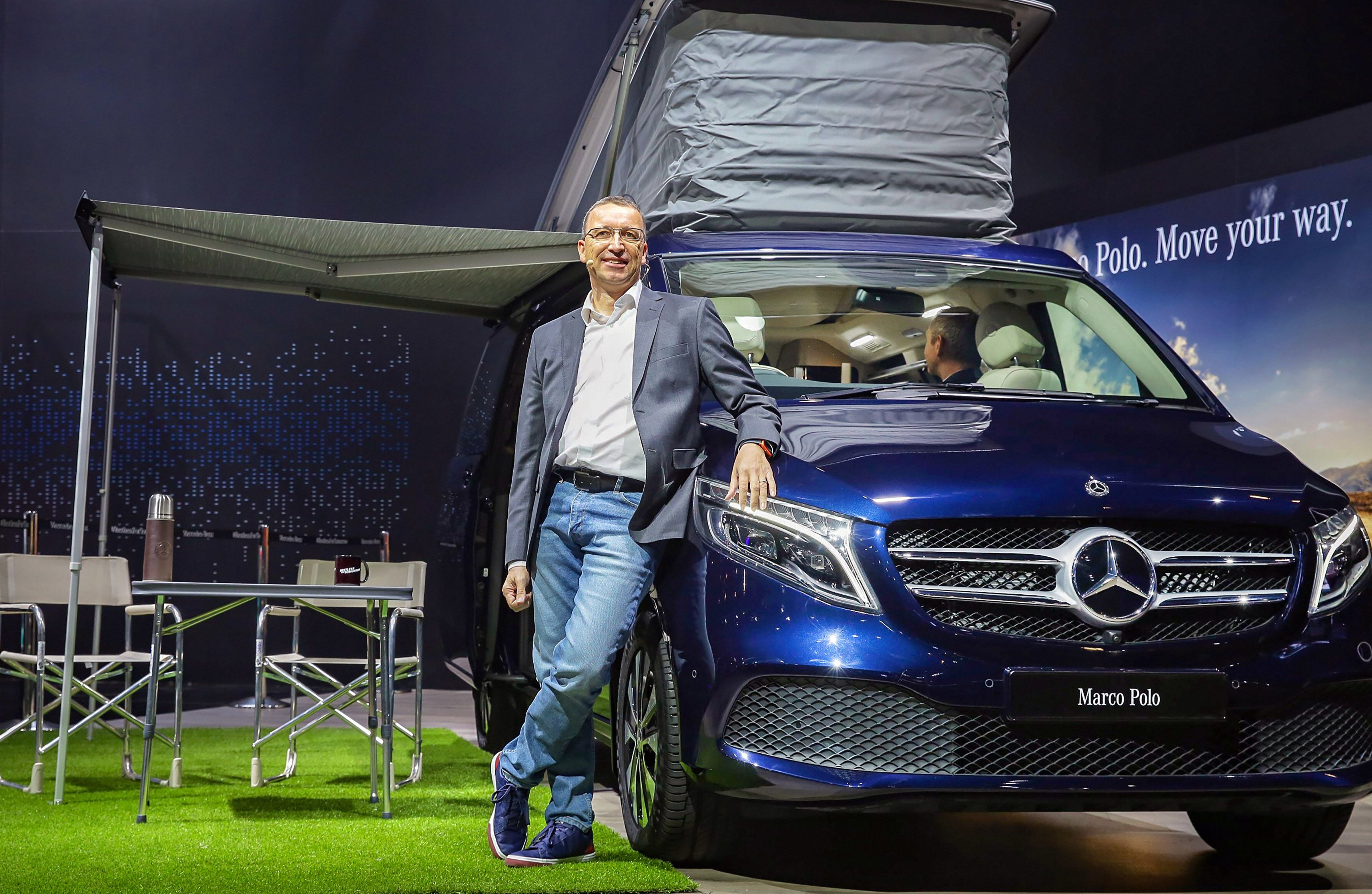 Martin Schwenk, CEO, Mercedes Benz India poses with the V-Class Marco Polo at the Auto Expo 2020.