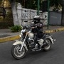 A member of female motorcycle club Ratgirls rides her motorbike along a street in Caracas. (AFP)