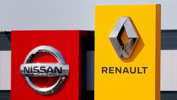 FILE PHOTO: The logos of car manufacturers Renault and Nissan are seen in front of dealerships of the companies in France. (REUTERS)