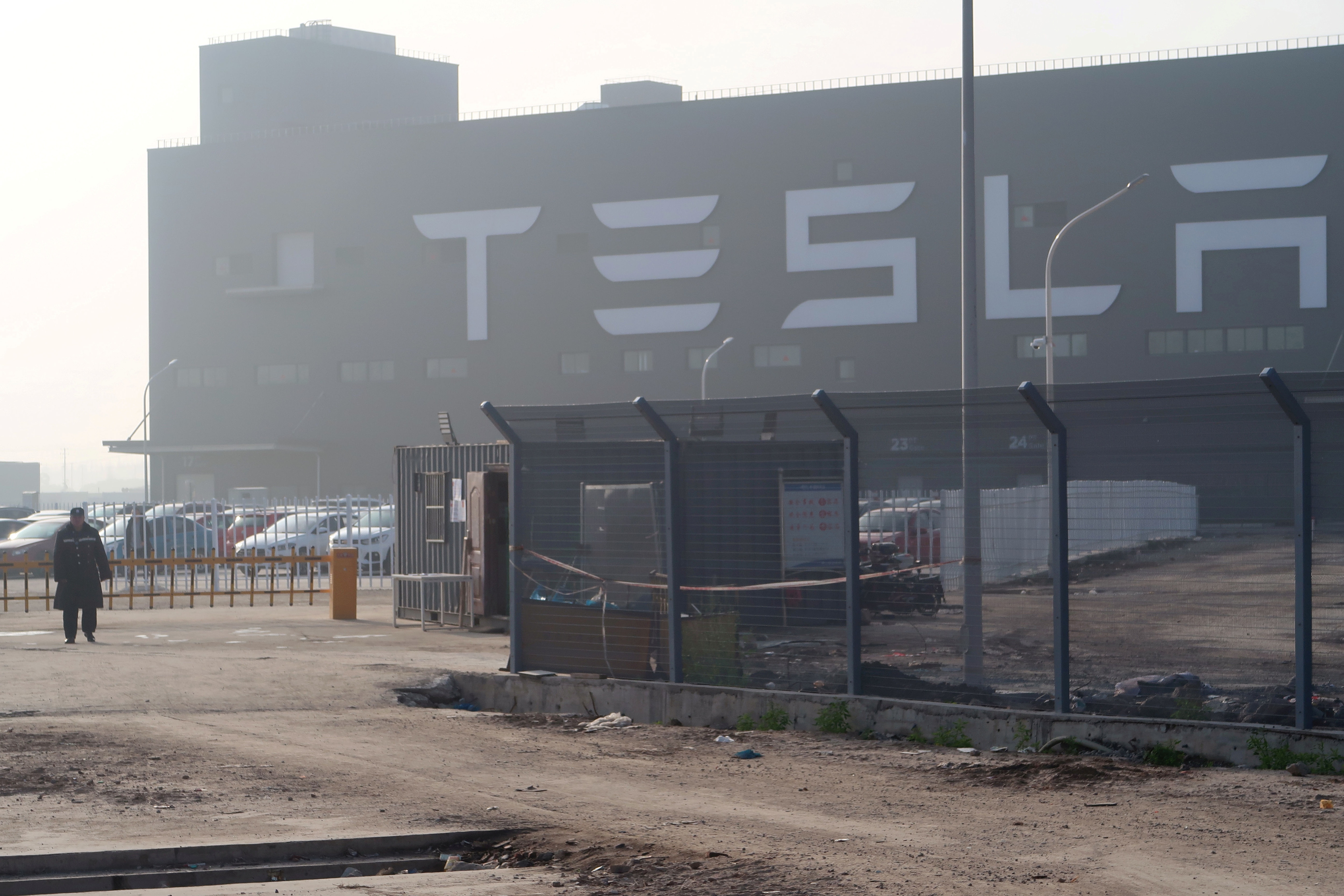 FILE PHOTO: A Tesla sign is seen on the Shanghai Gigafactory of the US electric car maker 