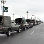 Pakistan's national flags flutter on an army convoy patrolling during a partial lockdown. (REUTERS)