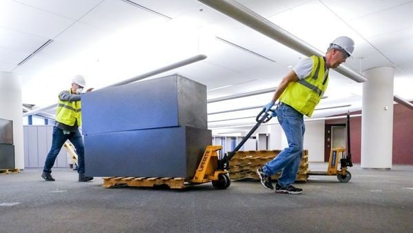 Workers clear furniture from a floor inside the GM Kokomo, Indiana building that General Motors and Ventec Life Systems are converting into use for the production of Ventec ventilators in response to the spread of the coronavirus disease. (VIA REUTERS)