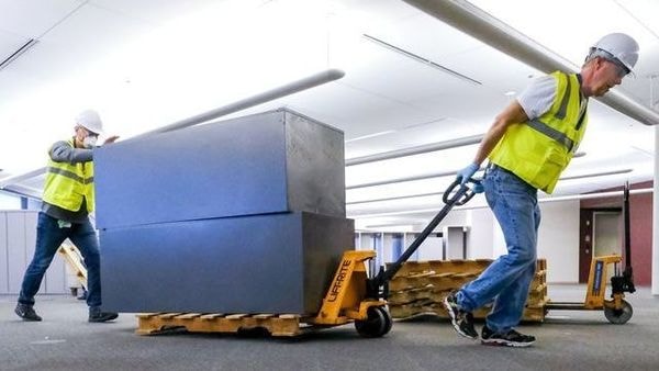 Workers clear furniture from a floor inside the GM Kokomo, Indiana building that General Motors and Ventec Life Systems are converting into use for the production of Ventec ventilators in response to the spread of the coronavirus disease in the US. (VIA REUTERS)