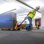 Workers clear furniture from a floor inside the GM Kokomo, Indiana building that General Motors and Ventec Life Systems are converting into use for the production of Ventec ventilators. (VIA REUTERS)