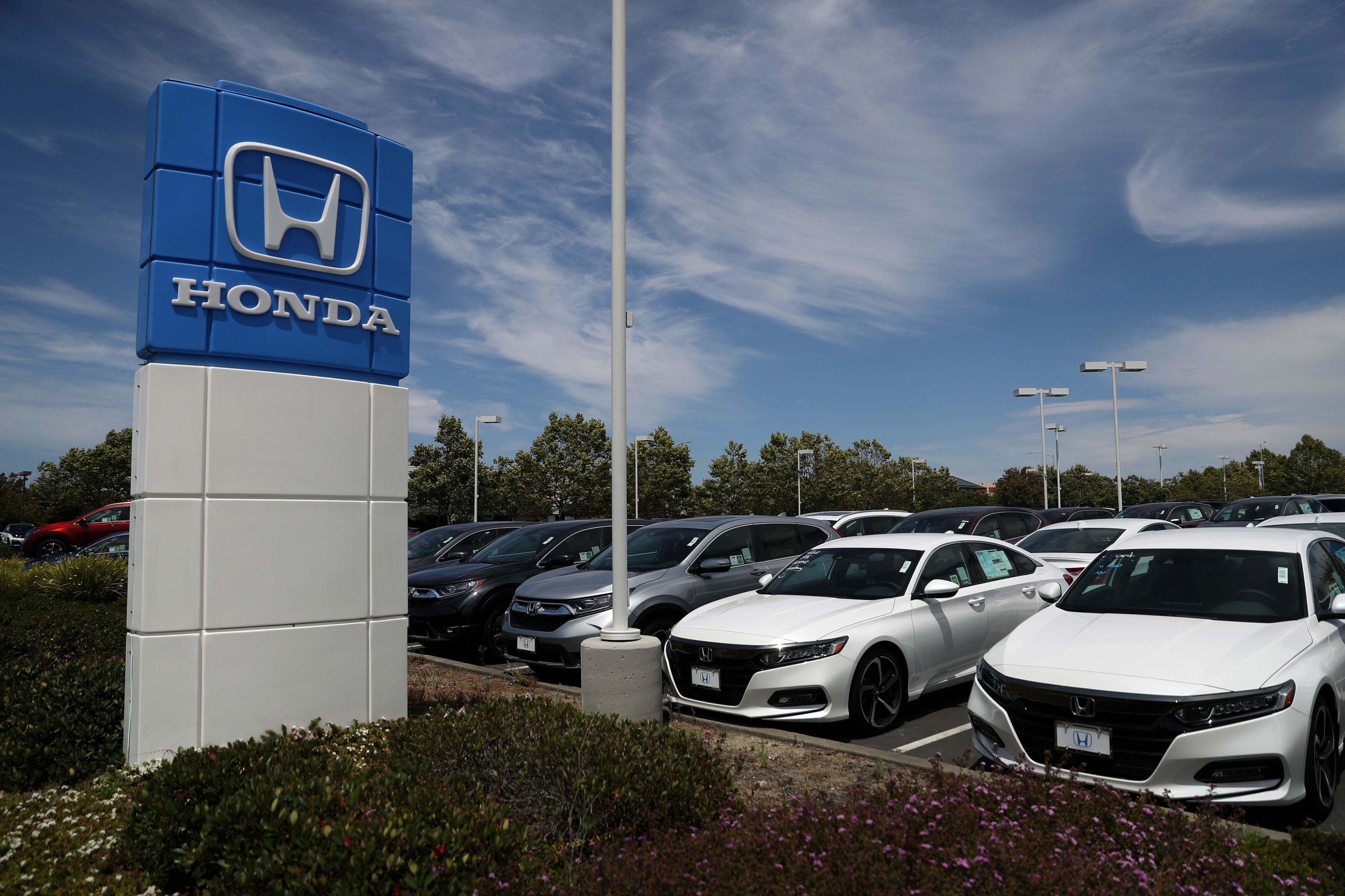 FILE PHOTO: In this file photo brand new Honda cars are displayed on the sales lot at Marin Honda in San Rafael, California. FILE PHOTO: In this file photo brand new Honda cars are displayed on the sales lot at Marin Honda in San Rafael, California.